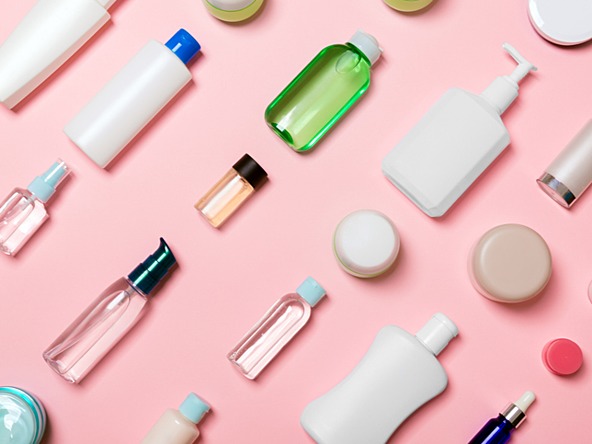 bottles and other product containers of varying sizes, all blank, without labels